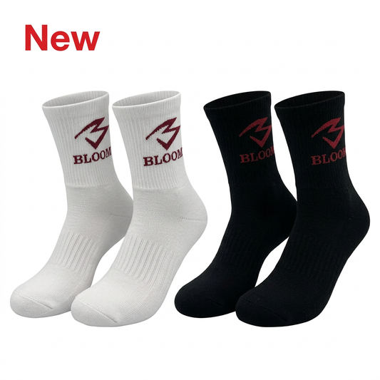 Black and white pairs of BLOOM U16 basketball socks with red New text