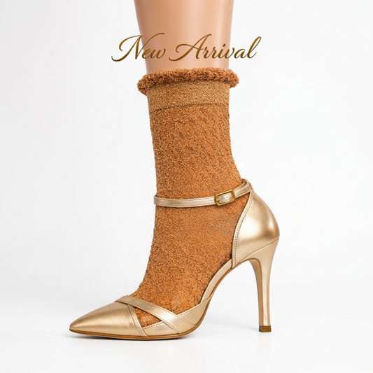 Gold lamé float sock and gold shoe in a square white catalog frame