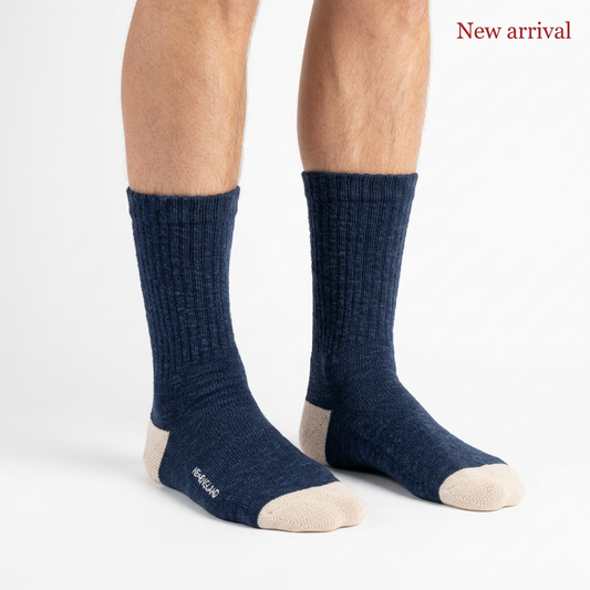 Navy NEWENGLAND socks worn on feet, with a white background and red New arrival text